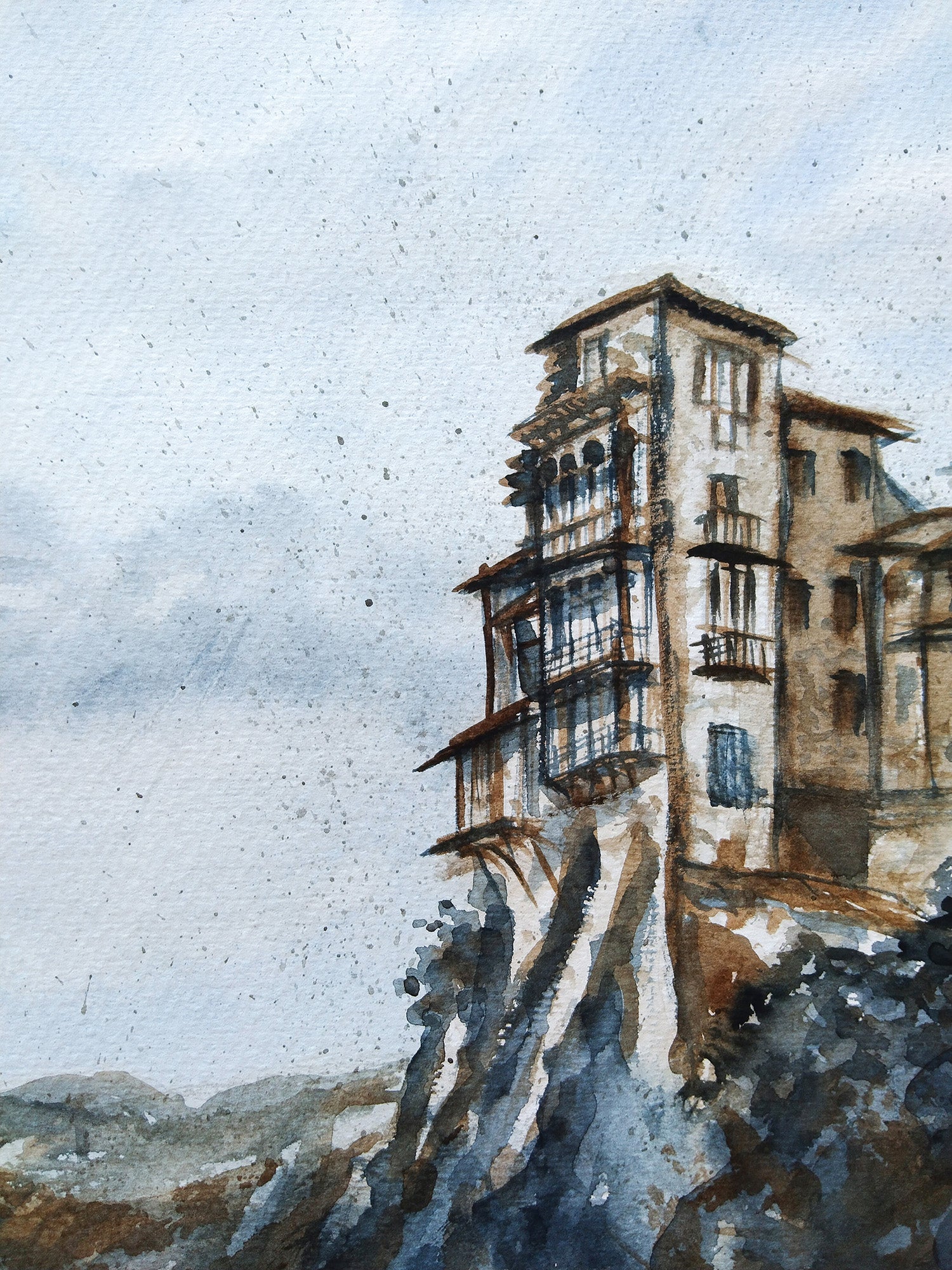 Detalle de las casas colgantes de Cuenca pintadas en acuarela, capturando su arquitectura desafiante sobre el abismo con tonos sombra tostada y gris azulado.