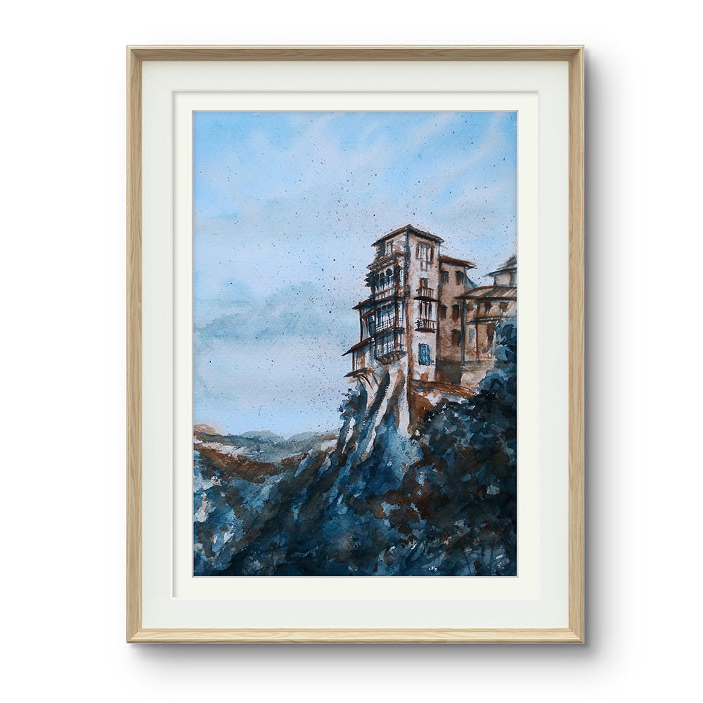 Acuarela de las casas colgantes de Cuenca enmarcada. Arte que refleja la resiliencia y la conexión con nuestras raíces.