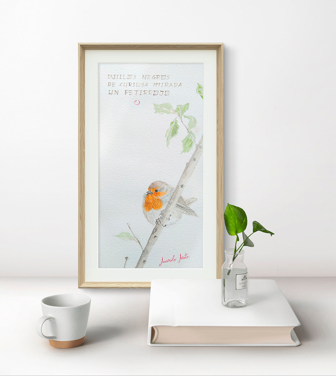 Acuarela Petirrojo enmarcada, decorando un espacio natural y sereno. Arte que inspira contemplación y armonía.